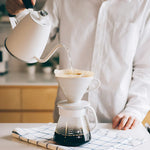 Hario V60 Ceramic Dripper Set 02 in use for hand-brewed coffee preparation.