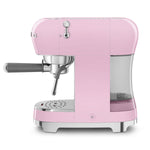 Smeg Espressomaschine ECF02PKEU in Cadillac Pink with compact design, intuitive controls, and stainless steel cup holder.