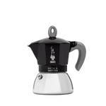 Bialetti New Moka Induction coffee maker in black, suitable for all stove types including induction, featuring ergonomic silicone handle and patented safety valve.