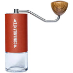 Comandante C40 MK4 Nitro Blade hand coffee grinder in Sunset color with ergonomic design.