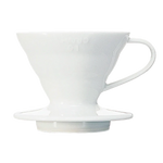 Hario V60 white ceramic coffee dripper, featuring spiral ridges and a conical design for optimal coffee extraction.
