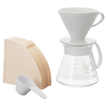 Hario V60 Ceramic Dripper Set 02 in white with filters and glass carafe.
