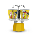 Bialetti Mini Express Set with yellow design and two ceramic espresso cups.