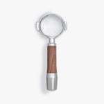Wiedemann bottomless portafilter with walnut handle for E61 group machines.